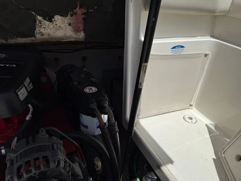 Slide: The Image of Engine compartment of a 2007 Chaparral 215 SSi boat, featuring Volvo Penta components. - 27