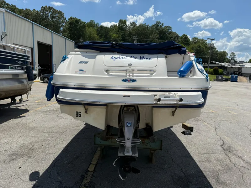 Slide: The Image of 2007 Chaparral 215 SSi boat parked outdoors, rear view, sunny day. - 3