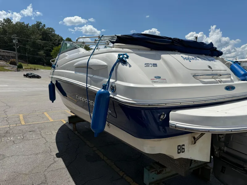 Slide: The Image of 2007 Chaparral 215 SSi boat on trailer, blue and white, parked outdoors. - 5