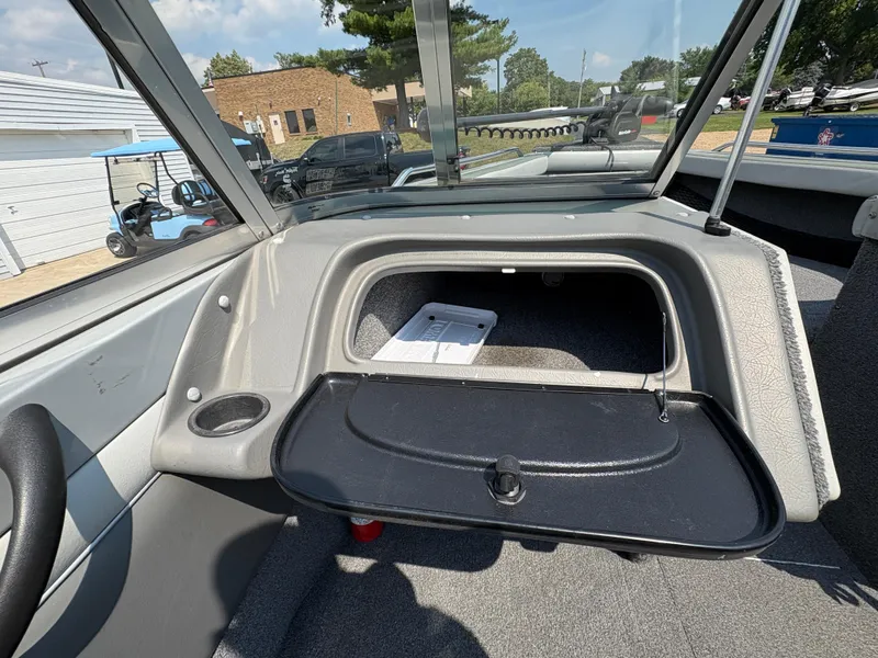 Slide: The Image of Interior of a 2001 Lund 1950 Tyee Magnum GS ITS boat, featuring storage compartment. - 20