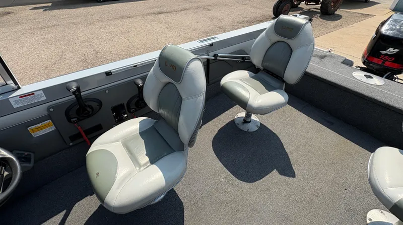 Slide: The Image of Interior of 2001 Lund 1950 Tyee Magnum GS ITS boat with two gray seats. - 23
