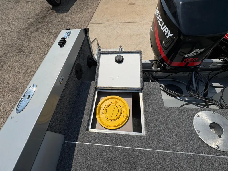 Slide: The Image of 2001 Lund 1950 Tyee Magnum GS ITS boat with Mercury 150 engine, open storage compartment. - 26