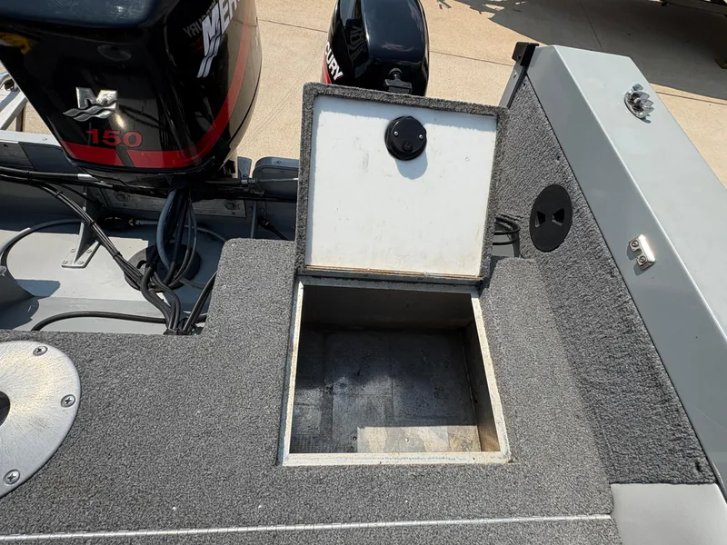 Slide: The Image of Open storage compartment on a 2001 Lund 1950 Tyee Magnum GS ITS boat. - 27