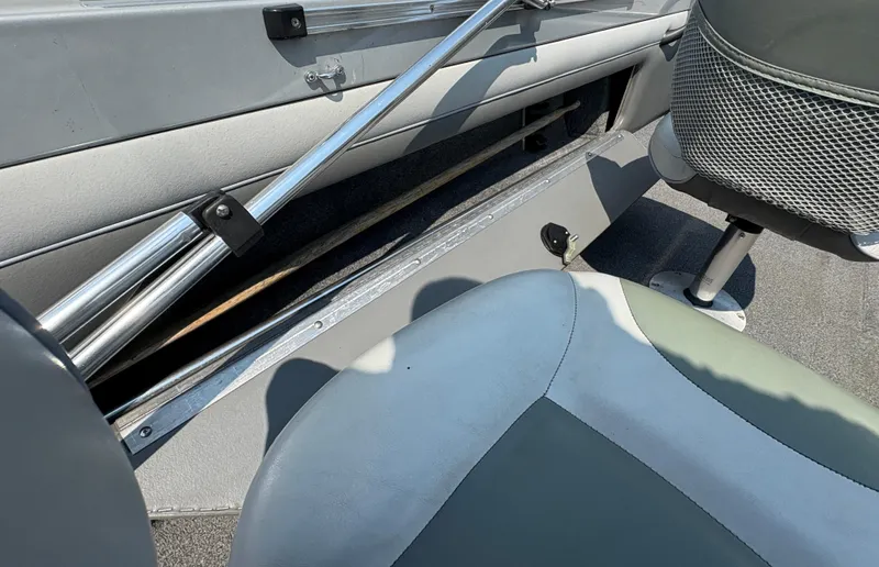 Slide: The Image of Interior of a 2001 Lund 1950 Tyee Magnum GS ITS boat, featuring seating and storage. - 29