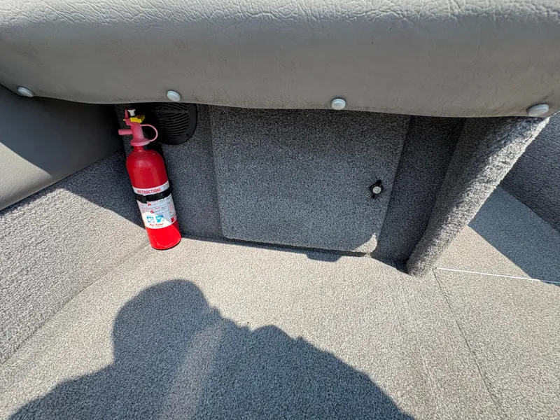 Slide: The Image of Fire extinguisher in a 2001 Lund 1950 Tyee Magnum GS ITS boat interior. - 30