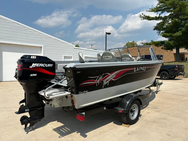 Slide: The Image of 2001 Lund 1950 Tyee Magnum GS ITS boat with Mercury XR6 engine on trailer. - 4