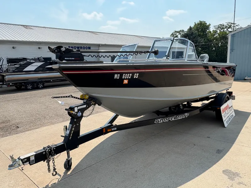 Slide: The Image of 2001 Lund 1950 Tyee Magnum GS ITS boat on ShoreLand'r trailer outside showroom. - 8