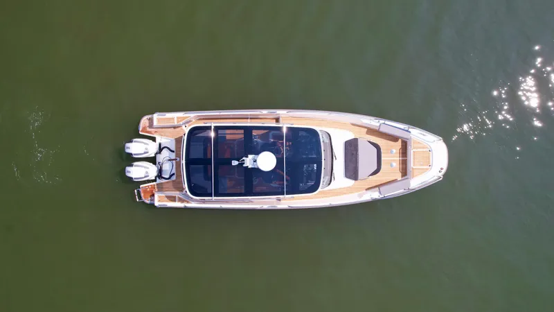 Slide: The Image of Aerial view of 2025 Nimbus T9 boat on calm water. - 5