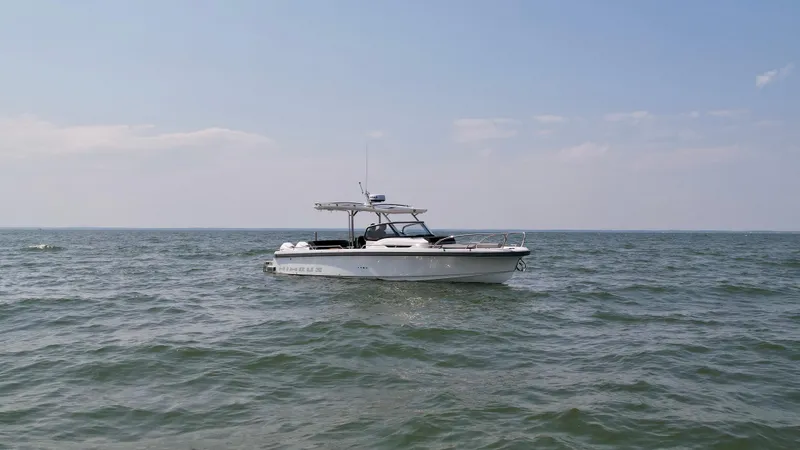 The Image of Nimbus T9 boat on open water under clear sky, 2025 model. - 0