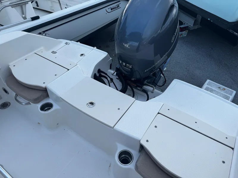 Slide: The Image of 2018 Robalo R180 Center Console boat interior with seating and Yamaha outboard motor. - 23