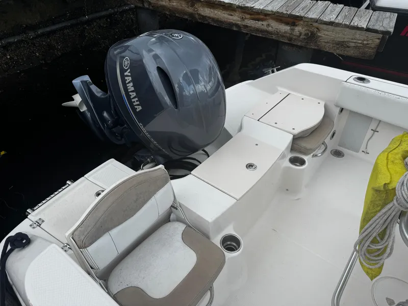 Slide: The Image of 2018 Robalo R180 Center Console boat with Yamaha engine docked at marina. - 26