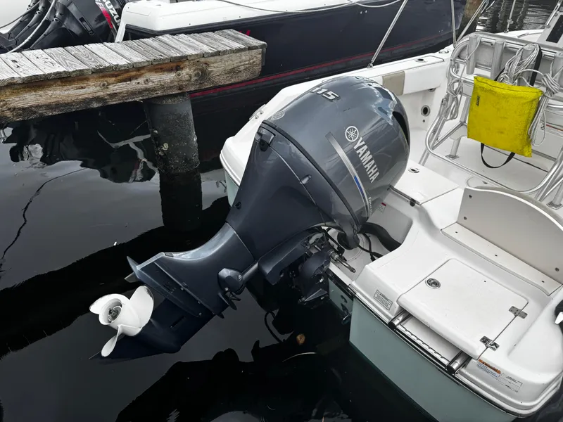 Slide: The Image of 2018 Robalo R180 Center Console boat with Yamaha outboard engine docked. - 27
