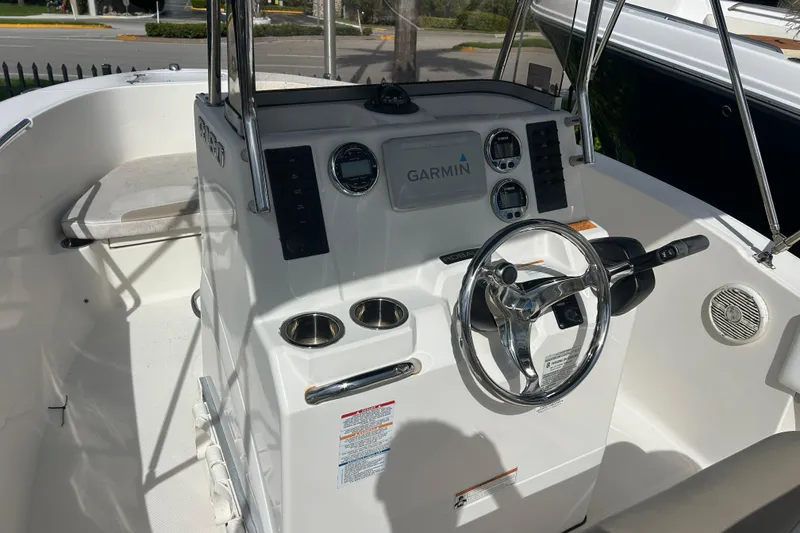 Slide: The Image of 2018 Robalo R180 Center Console boat dashboard with Garmin navigation system. - 5