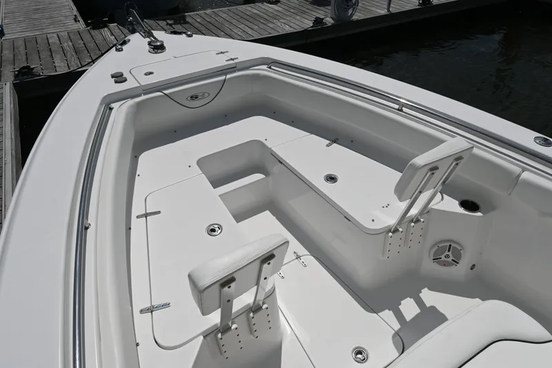 Slide: The Image of 2013 Sea Hunt Gamefish 27 boat interior with seating and storage compartments. - 18