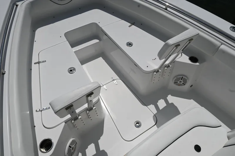 Slide: The Image of 2013 Sea Hunt Gamefish 27 boat interior with seating and storage compartments. - 21