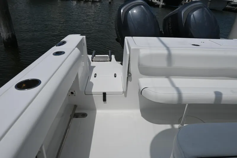 Slide: The Image of 2013 Sea Hunt Gamefish 27 boat interior with dual engines and seating. - 37
