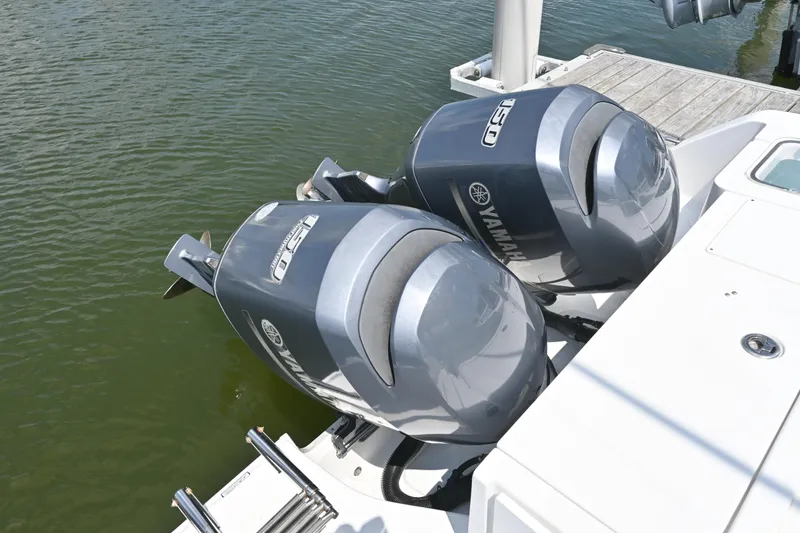 Slide: The Image of Twin Yamaha 150 engines on a 2013 Sea Hunt Gamefish 27 boat. - 39