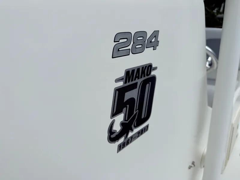 Slide: The Image of 2018 Mako 284 CC boat logo celebrating 50th anniversary, 1967-2017. - 10