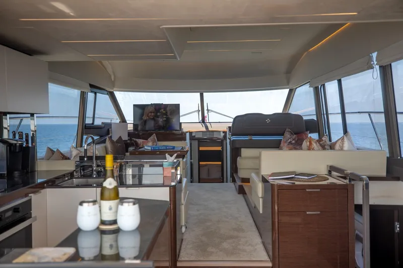 Slide: The Image of Luxurious interior of 2020 Prestige 590 Flybridge Cruiser with modern amenities and ocean view. - 20