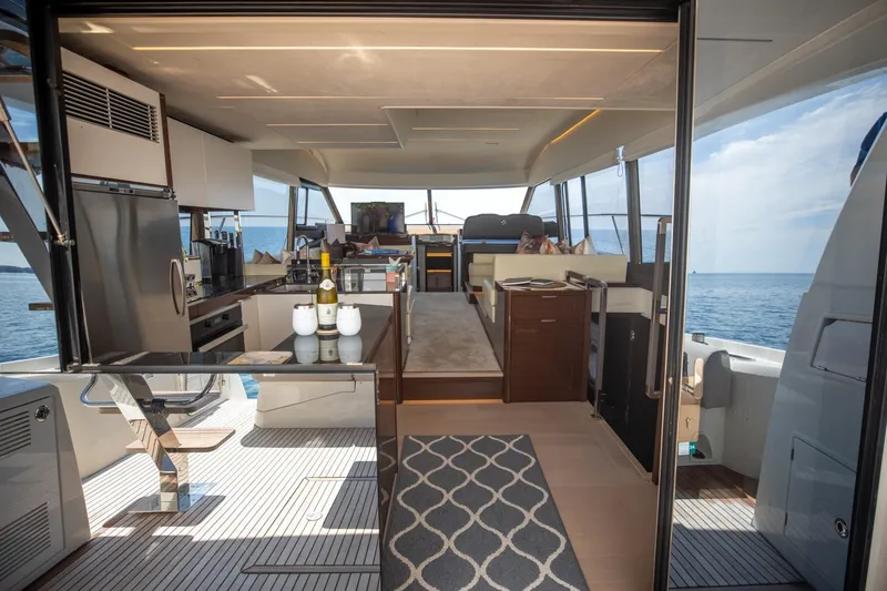 Slide: The Image of Luxurious interior of 2020 Prestige 590 Flybridge Cruiser with ocean view. - 21