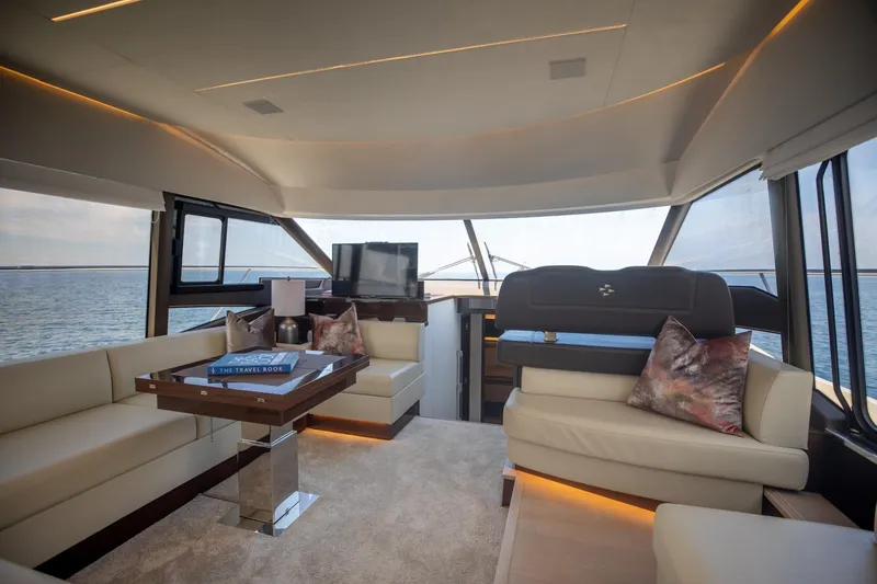 Slide: The Image of Luxurious interior of 2020 Prestige 590 Flybridge Cruiser with elegant seating and ocean view. - 22