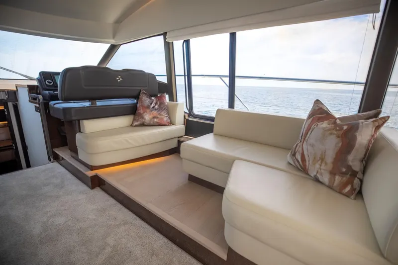 Slide: The Image of Luxurious interior of 2020 Prestige 590 Flybridge Cruiser with elegant seating and ocean view. - 24