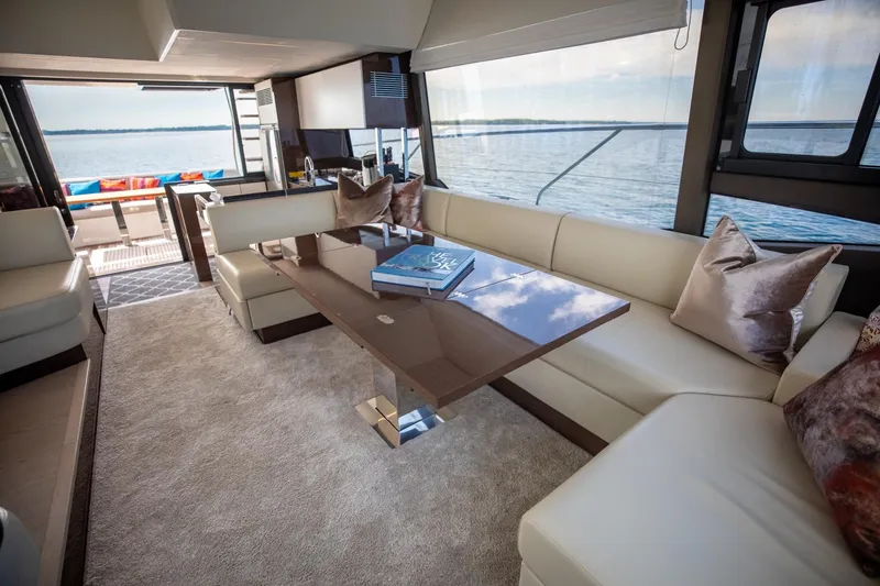 Slide: The Image of Luxurious interior of 2020 Prestige 590 Flybridge Cruiser with elegant seating and scenic ocean view. - 31