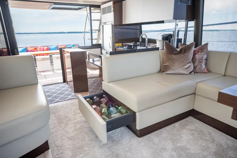 Slide: The Image of Luxurious interior of 2020 Prestige 590 Flybridge Cruiser with elegant seating and ocean view. - 32