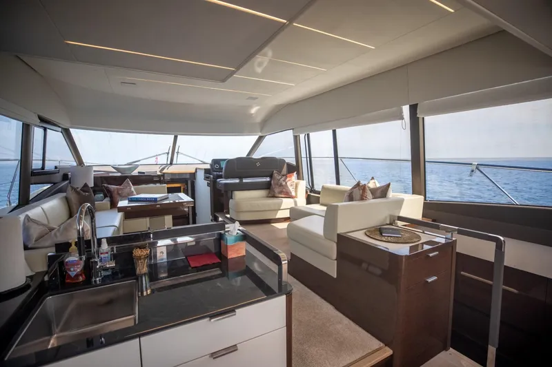 Slide: The Image of Luxurious interior of 2020 Prestige 590 Flybridge Cruiser with modern furnishings and ocean view. - 34