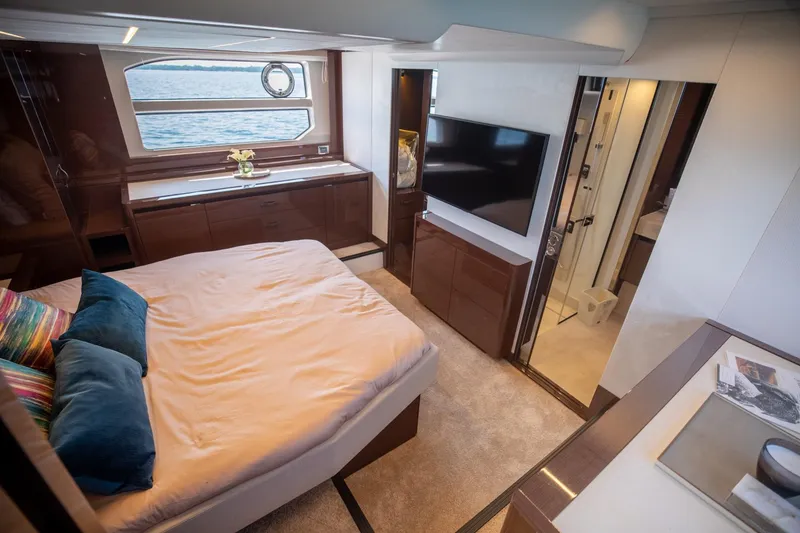 Slide: The Image of Luxurious bedroom interior of 2020 Prestige 590 Flybridge Cruiser with sea view window. - 35