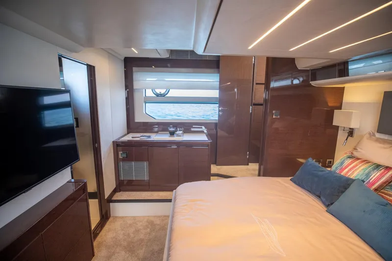 Slide: The Image of Luxurious interior of 2020 Prestige 590 Flybridge Cruiser with modern bedroom and sea view. - 37