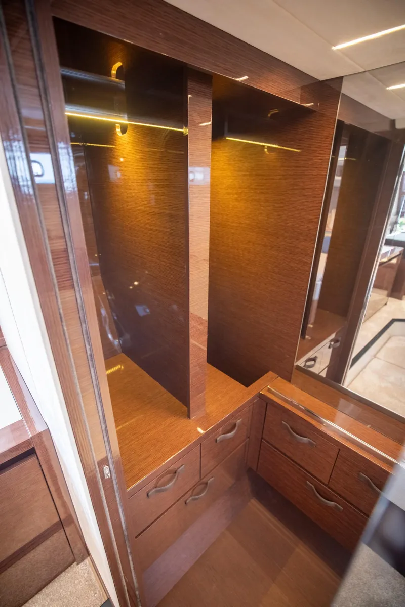 Slide: The Image of Luxurious wooden cabinetry in 2020 Prestige 590 Flybridge Cruiser yacht interior. - 39