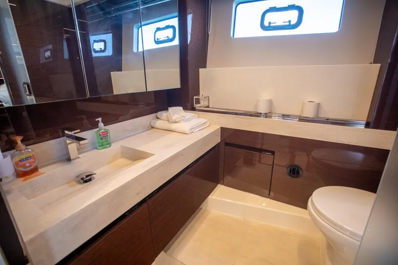 Slide: The Image of Luxurious bathroom in 2020 Prestige 590 Flybridge Cruiser yacht, featuring modern fixtures and elegant design. - 41