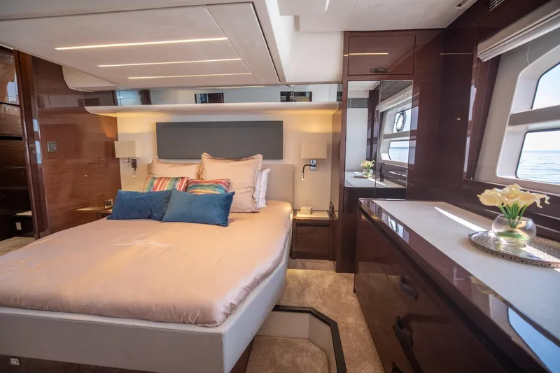Slide: The Image of Luxurious bedroom interior of 2020 Prestige 590 Flybridge Cruiser with elegant decor and ocean view. - 43