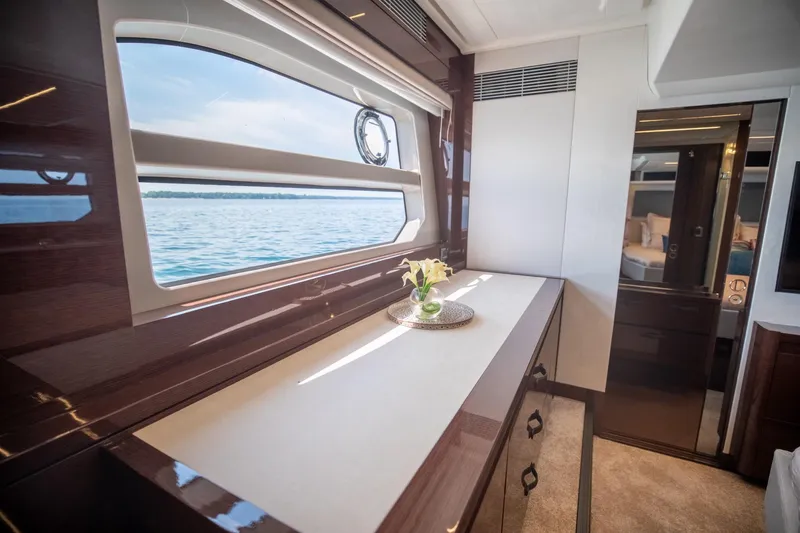 Slide: The Image of Luxurious interior of 2020 Prestige 590 Flybridge Cruiser with ocean view window. - 45