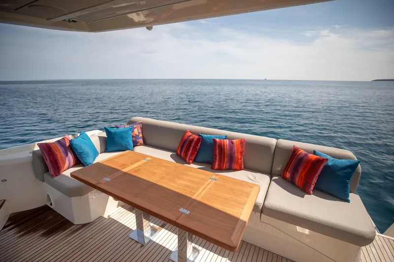 Slide: The Image of Luxurious seating area on 2020 Prestige 590 Flybridge Cruiser with ocean view. - 9
