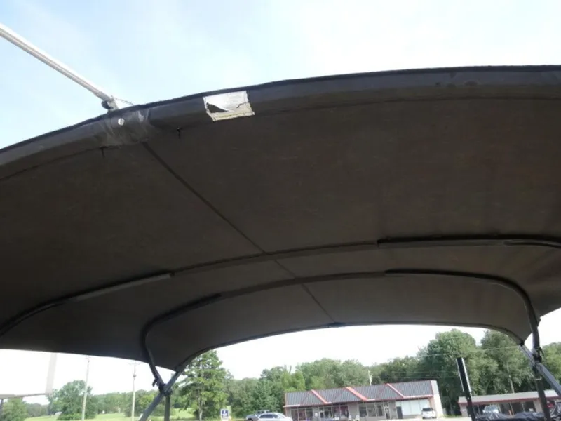 Slide: The Image of 2018 Starcraft MX23L boat canopy with visible patch repair. - 13