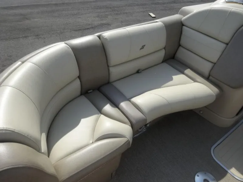 Slide: The Image of 2018 Starcraft MX23L boat interior with beige leather seating. - 4
