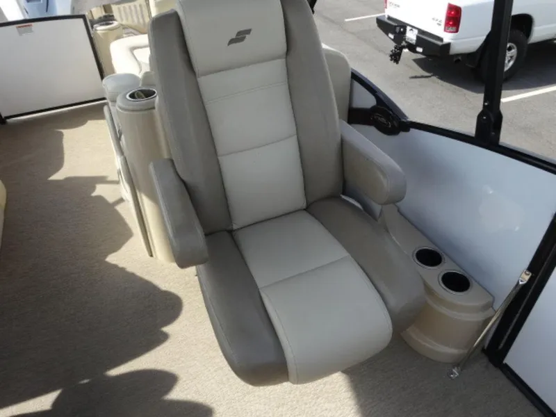 Slide: The Image of 2018 Starcraft MX23L boat seat with armrests and cup holders. - 8