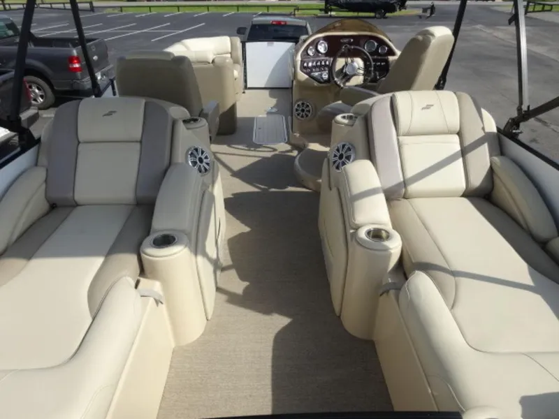 Slide: The Image of Luxurious interior of 2018 Starcraft MX23L boat with beige seating and modern dashboard. - 9