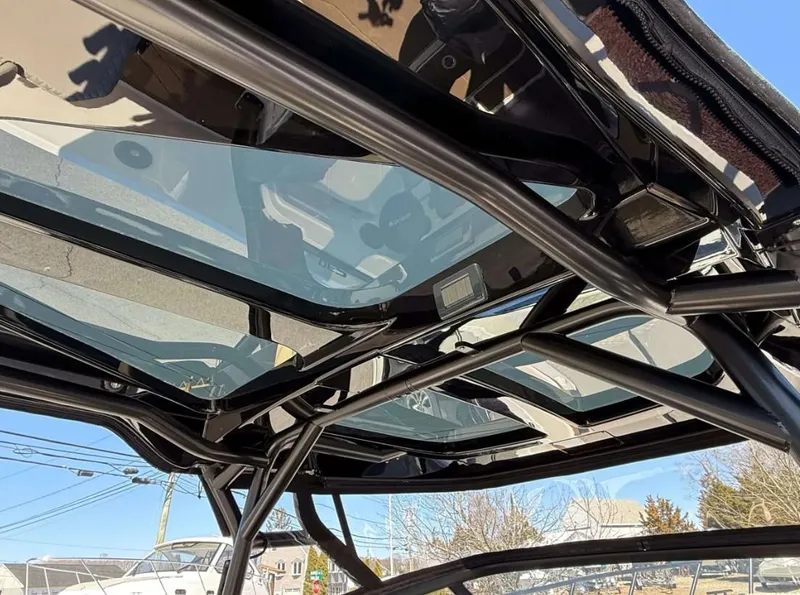Slide: The Image of Navan S30 2025 boat roof with sleek glass panels and sturdy black frame. - 10
