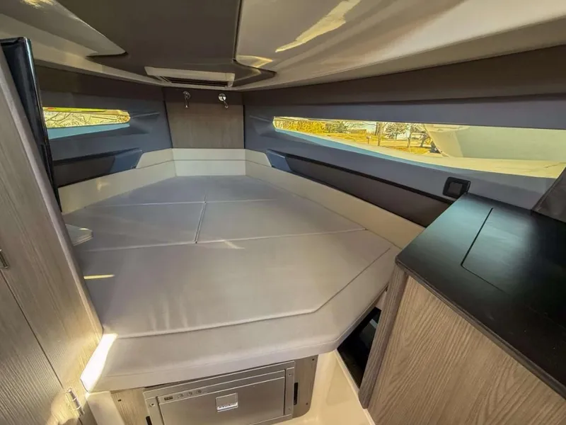 Slide: The Image of Interior cabin of 2025 Navan S30 boat, featuring modern design and comfortable seating. - 14
