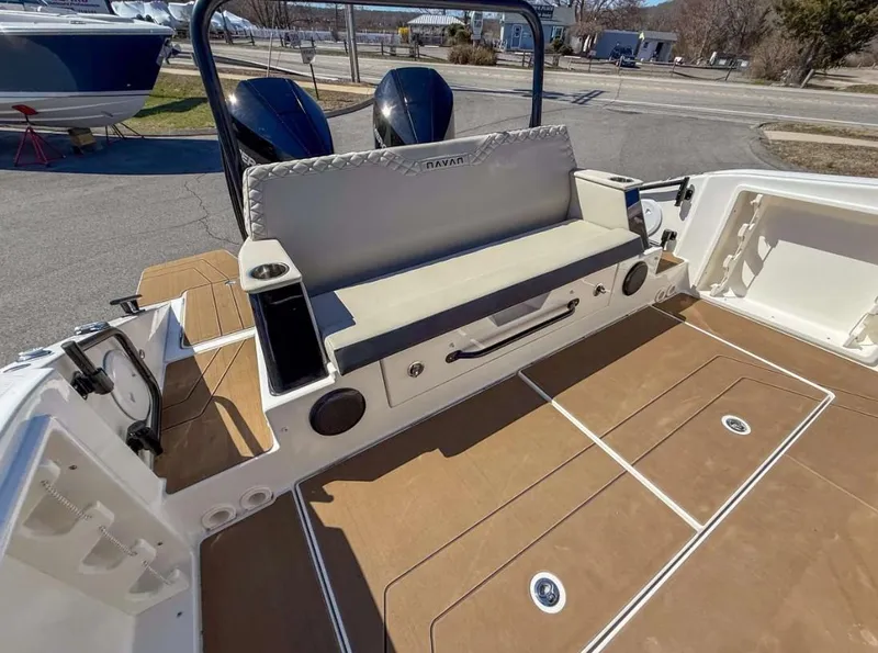 Slide: The Image of Navan S30 2025 boat interior with cushioned seating and dual outboard motors. - 15