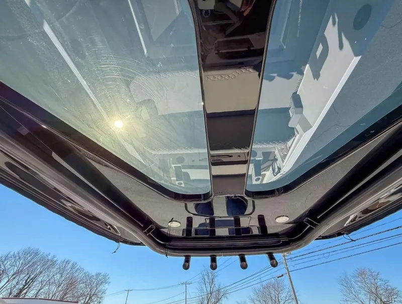 Slide: The Image of Rooftop view of 2025 Navan S30 with sunroof and clear blue sky. - 18