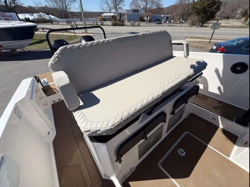 Slide: The Image of 2025 Navan S30 boat interior with cushioned seating and storage compartments. - 20