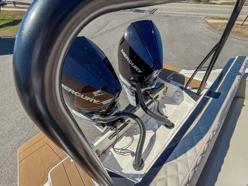 Slide: The Image of 2025 Navan S30 boat with dual Mercury outboard engines, viewed from the deck. - 21