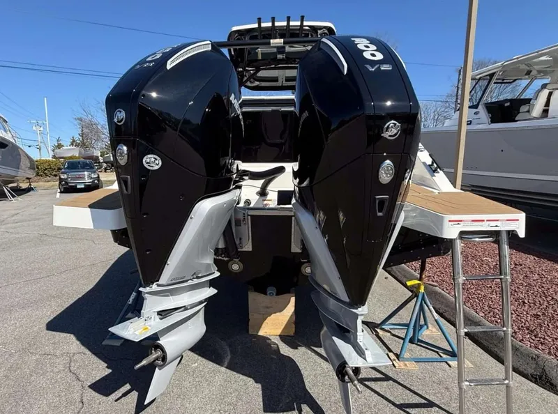 Slide: The Image of Twin outboard engines on a 2025 Navan S30 boat, parked outdoors. - 6