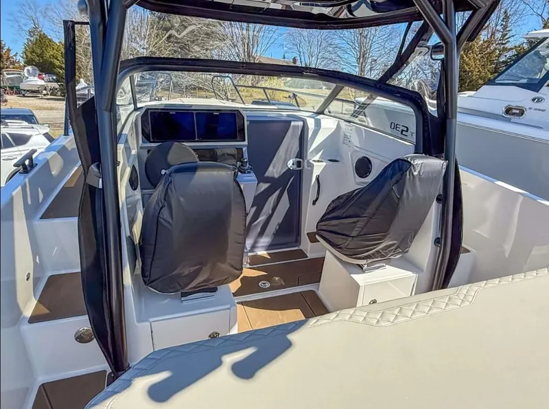 Slide: The Image of Interior view of 2025 Navan S30 boat, featuring modern seating and navigation equipment. - 8