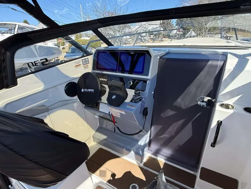 Slide: The Image of Interior view of 2025 Navan S30 boat cockpit with modern controls and steering wheel. - 9