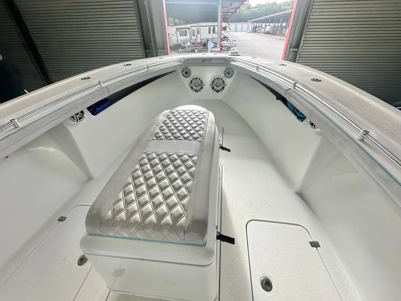 Slide: The Image of 2021 Yellowfin 36 Offshore boat interior with diamond-stitched seating and storage compartments. - 13